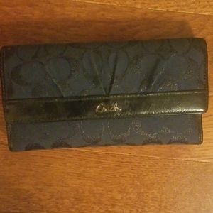 Navy blue coach wallet with black trim